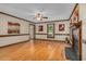 Bright living room with hardwood floors, fireplace, and large windows at 817 S Creek Dr, Nashville, NC 27856