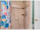 Shower with neutral tile, shower head, and soap dish at 817 S Creek Dr, Nashville, NC 27856