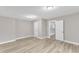 Bedroom featuring light tan walls, plush carpet, and a view into the hallway at 8201 Rhodes Rd, Apex, NC 27539