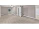 Spacious bedroom featuring neutral tones, carpet, ceiling fan, and natural light at 8201 Rhodes Rd, Apex, NC 27539