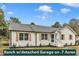 Charming white brick ranch home featuring a teal front door and light brown window shutters at 8201 Rhodes Rd, Apex, NC 27539