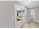 Hallway with backyard access through sliding doors and a deck for outdoor enjoyment at 8201 Rhodes Rd, Apex, NC 27539
