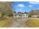 Cozy single-story home with a neatly kept yard, fresh paint, and convenient parking at 8201 Rhodes Rd, Apex, NC 27539