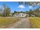 Charming single-story home with a well-maintained yard and ample parking at 8201 Rhodes Rd, Apex, NC 27539