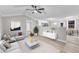 Open concept living room boasts neutral colors, vaulted ceilings and seamless flow to the kitchen at 8201 Rhodes Rd, Apex, NC 27539