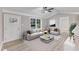 Inviting living room filled with natural light, neutral furnishings, and a stylish rug and flooring at 8201 Rhodes Rd, Apex, NC 27539