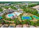 Aerial view of the community pool, clubhouse, and tennis courts, highlighting the neighborhood's amenities at 8525 Holdenby Trl, Raleigh, NC 27616
