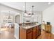 Well-designed kitchen island connects to the dining and living areas, perfect for modern living at 8525 Holdenby Trl, Raleigh, NC 27616