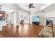 Spacious living room featuring hardwood floors, fireplace, and an open layout for entertaining and relaxation at 8525 Holdenby Trl, Raleigh, NC 27616