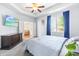 Well-lit main bedroom with a ceiling fan, neutral walls, and convenient access to the living room and bathroom at 8525 Holdenby Trl, Raleigh, NC 27616
