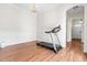 Versatile room with wood floors, a chair rail, and ample space for your home gym or office at 8525 Holdenby Trl, Raleigh, NC 27616