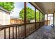 Screened porch with bluestone floor and view of fenced back yard at 8525 Holdenby Trl, Raleigh, NC 27616