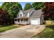 Charming two-story home with a welcoming front porch and an attached garage at 928 Broadhaven Dr, Raleigh, NC 27603