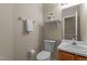 Well-lit powder room features a pedestal sink, decorative shelf, and neutral decor at 928 Broadhaven Dr, Raleigh, NC 27603