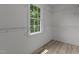 A light and airy walk-in closet with a large window and built-in shelving system for optimal storage at 928 Broadhaven Dr, Raleigh, NC 27603