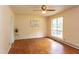 A sun-lit living room features hardwood floors and a large window for ample natural light at 107 Glosson Cir, Carrboro, NC 27510