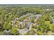 High angle aerial view of homes in the community near wooded area at 110 Tressel Way, Durham, NC 27707
