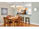 Cozy dining area with wooden table and chairs adjacent to kitchen at 110 Tressel Way, Durham, NC 27707