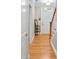 Inviting foyer with gleaming hardwood floors, staircase, and a decorative table at 110 Tressel Way, Durham, NC 27707