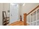 Bright foyer showcasing hardwood floors, staircase, and a decoratively styled table at 110 Tressel Way, Durham, NC 27707