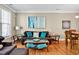 Comfortable living room with stylish furniture, hardwood floors, and bright artwork creating a warm ambiance at 110 Tressel Way, Durham, NC 27707