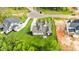 Aerial view of a modern home with pristine landscaping and ample parking at 1108 Delilia Ln, Wake Forest, NC 27587