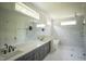Modern bathroom with double vanity, soaking tub, and a walk-in glass shower at 1108 Delilia Ln, Wake Forest, NC 27587