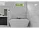 Elegant bathroom featuring a luxurious soaking tub and stylish fixtures at 1108 Delilia Ln, Wake Forest, NC 27587