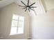 Bright bedroom with a large window and ceiling fan at 1108 Delilia Ln, Wake Forest, NC 27587