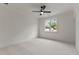 Bright bedroom with a ceiling fan and a window that lets in natural light and with neutral colored carpet at 1108 Delilia Ln, Wake Forest, NC 27587
