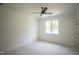 Bedroom featuring a window, carpet, and ceiling fan at 1108 Delilia Ln, Wake Forest, NC 27587