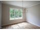 Dining area with hardwood flooring and views of the backyard at 1108 Delilia Ln, Wake Forest, NC 27587