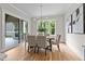 Dining room with natural light, modern chandelier and fireplace view from sliding door at 1108 Delilia Ln, Wake Forest, NC 27587