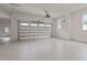 Spacious three-car garage with white walls, epoxy floors and ample natural light at 1108 Delilia Ln, Wake Forest, NC 27587