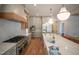 Spacious kitchen with marble countertops, stainless steel appliances, and custom cabinetry provides a modern culinary space at 1108 Delilia Ln, Wake Forest, NC 27587