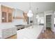Modern kitchen with quartz countertops, stainless steel appliances, and pendant lighting at 1108 Delilia Ln, Wake Forest, NC 27587