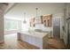 Spacious kitchen with a large island, ample cabinet space, and hardwood floors at 1108 Delilia Ln, Wake Forest, NC 27587