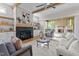 Cozy living room with fireplace and built-in shelving with access to outdoor living area at 1108 Delilia Ln, Wake Forest, NC 27587