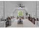 Bright living room with carpet, comfortable seating, large window, and ceiling fan at 1108 Delilia Ln, Wake Forest, NC 27587