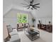 Bright living room with carpet, comfortable seating, large window, and ceiling fan at 1108 Delilia Ln, Wake Forest, NC 27587