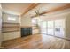 Inviting living room featuring a fireplace, built-in shelving, and hardwood floors at 1108 Delilia Ln, Wake Forest, NC 27587