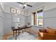 Charming home office with gray wainscoting, natural light, ceiling fan, and wooden desk at 1108 Delilia Ln, Wake Forest, NC 27587