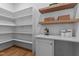 Well-organized pantry with ample shelving and countertop space for storage and food preparation at 1108 Delilia Ln, Wake Forest, NC 27587