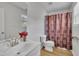 Bright bathroom featuring a white vanity and decorative shower curtain at 1198 Shining Water Ln, Creedmoor, NC 27522