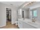 Bathroom boasts double sinks, walk-in closet and marble-look shower at 1198 Shining Water Ln, Creedmoor, NC 27522