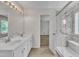 Spacious bathroom showcasing double sinks, shower with glass door, and modern fixtures at 1198 Shining Water Ln, Creedmoor, NC 27522
