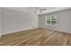 Bedroom showcasing modern flooring, neutral paint, and a bright window at 1198 Shining Water Ln, Creedmoor, NC 27522
