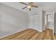 Bedroom with wood look floors, ceiling fan and closet at 1198 Shining Water Ln, Creedmoor, NC 27522