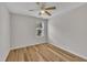 A bedroom with wood look floors, a ceiling fan and a window at 1198 Shining Water Ln, Creedmoor, NC 27522