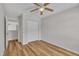 Bedroom with wood look floors, a ceiling fan and closet at 1198 Shining Water Ln, Creedmoor, NC 27522